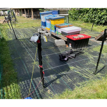 Load image into Gallery viewer, Bear Sentry electric fence surrounding beehives